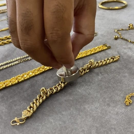 How to Test Gold at Home: Simple Methods for Authenticity 1 hand holding magnet to test gold authenticity